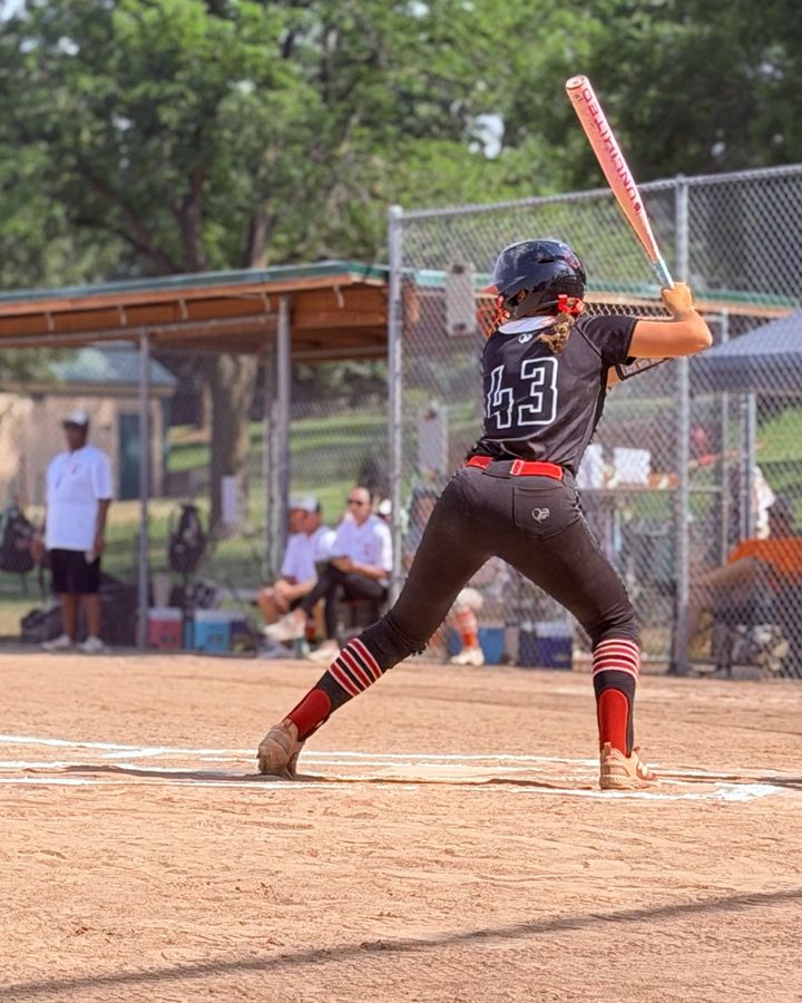 Mia Mead in her batting stance wearing number 43